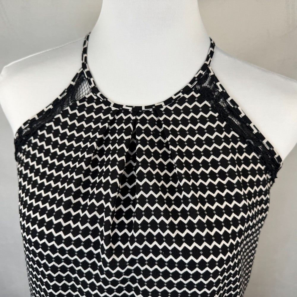 Front top deetail Candies Black and white patterned top on a mannequin against a neutral background