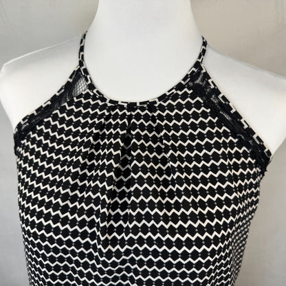 Front top deetail Candies Black and white patterned top on a mannequin against a neutral background