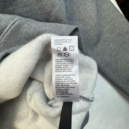 Clothing care label view of CAT gray hoodie size m