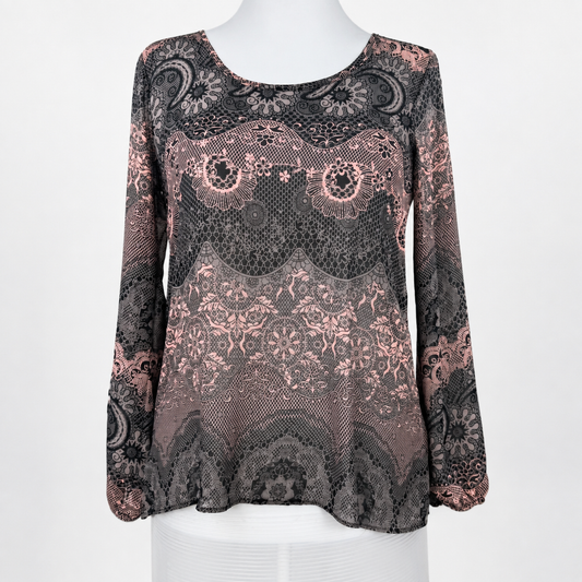 A long-sleeve lace top displayed on a white mannequin torso against a plain white background. The top features an intricate floral and paisley lace pattern in black and dusty rose pink.