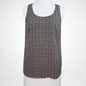 A sleeveless scoop-neck top with an all-over small black and white floral or ditsy print, displayed on a white mannequin torso against a light gray background.