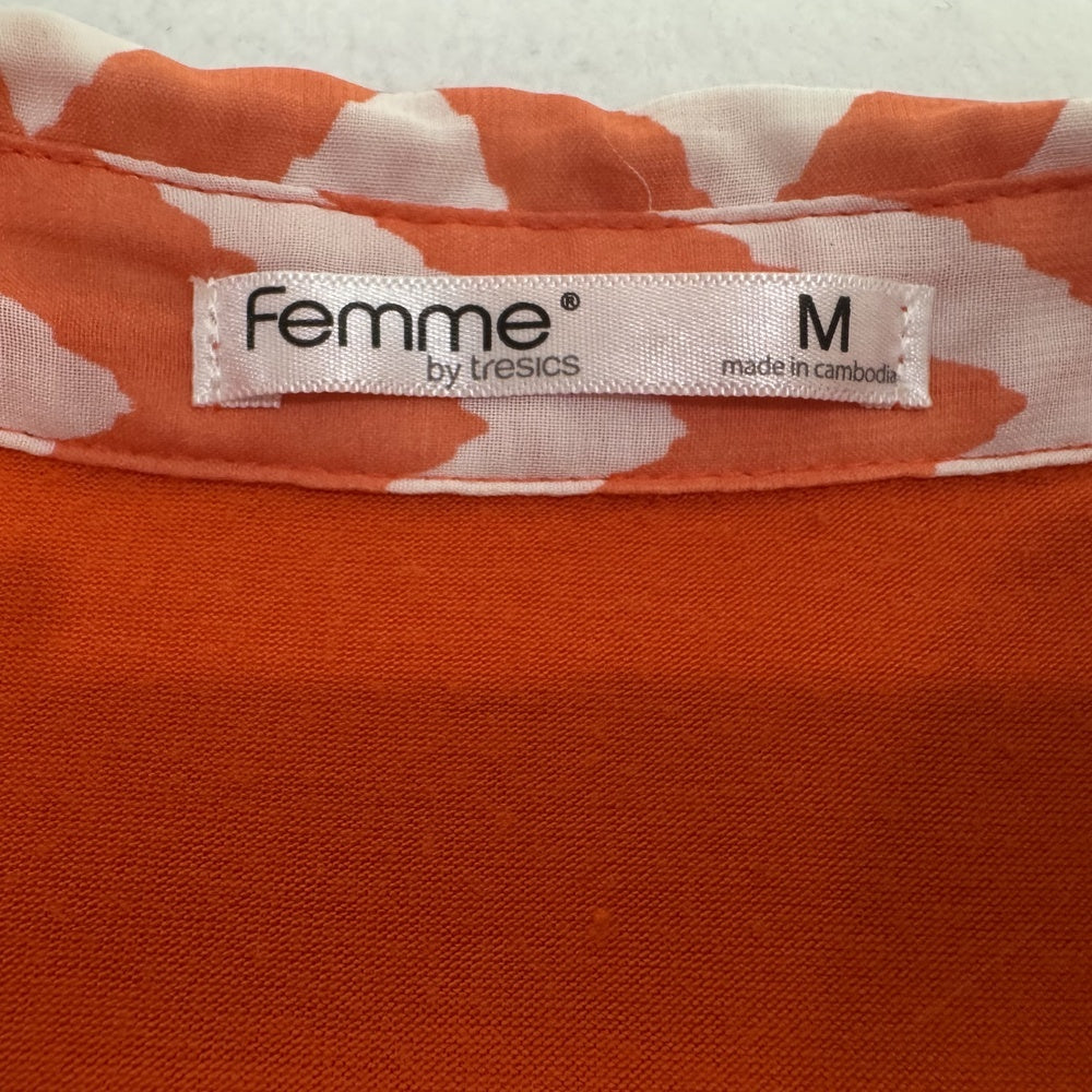 Clothing tag view on Femme by Tresics orange blouse with chevron pattern.