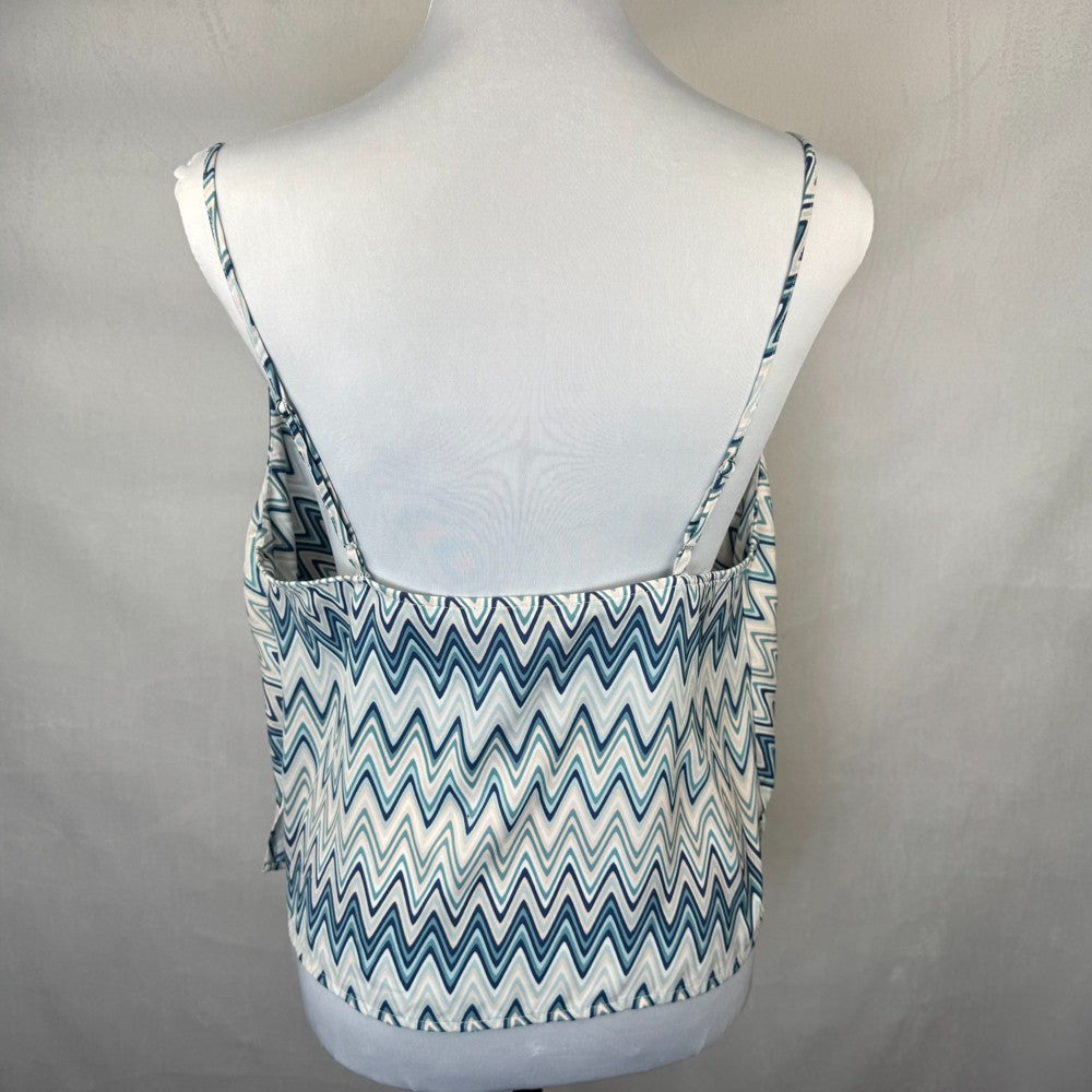 Back view of Forever 21 Blue and white zigzag patterned tank top on a mannequin against a plain background