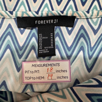 Clothing tag view on a Forever 21 tank top label with measurements