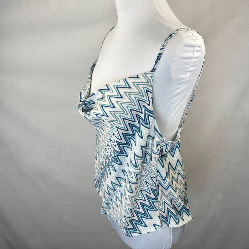 Side view of Forever 21 White tank top with blue zigzag pattern on a mannequin against a gray background