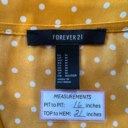 Clothing tag on Forever 21 women's blouse yellow, size M