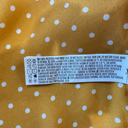 Material tag on Forever 21 women's blouse yellow, size M