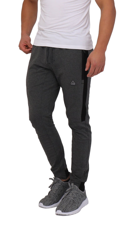 Men's SCR Sportswear Infinite Flex tall fit jogger pants in dark charcoal gray with black side stripe, drawstring waist, and tapered legs.
