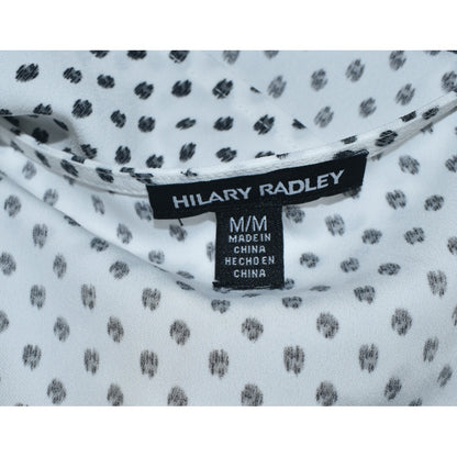 Clothing tag on Hilary Radley blouse white with black polka dots on a white background