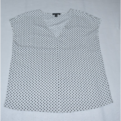 Front view of Hilary Radley white sleeveless top with black polka dot pattern on a light gray background