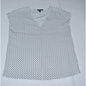 Front view of Hilary Radley white sleeveless top with black polka dot pattern on a light gray background