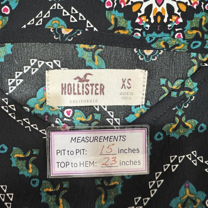 Clothing tag view on a Hollister garment with measurements displayed