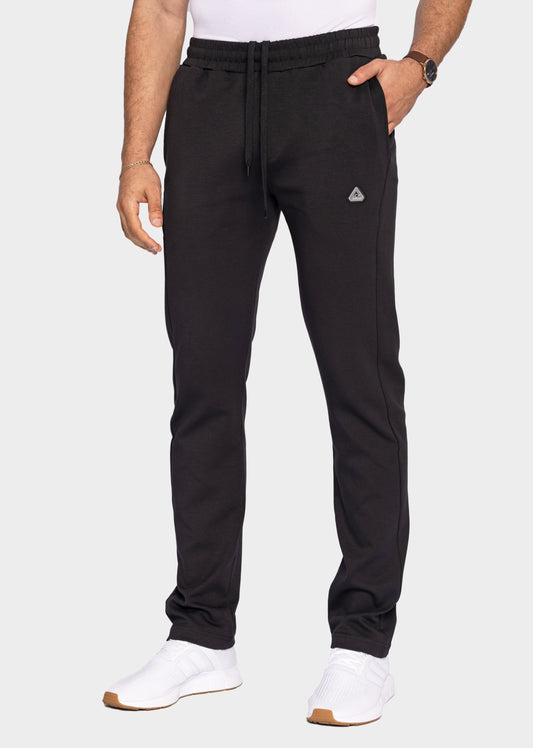 SCR Sportswear men's black classic athleisure tapered sweatpants in tall fit with drawstring waist, modeled front view.
