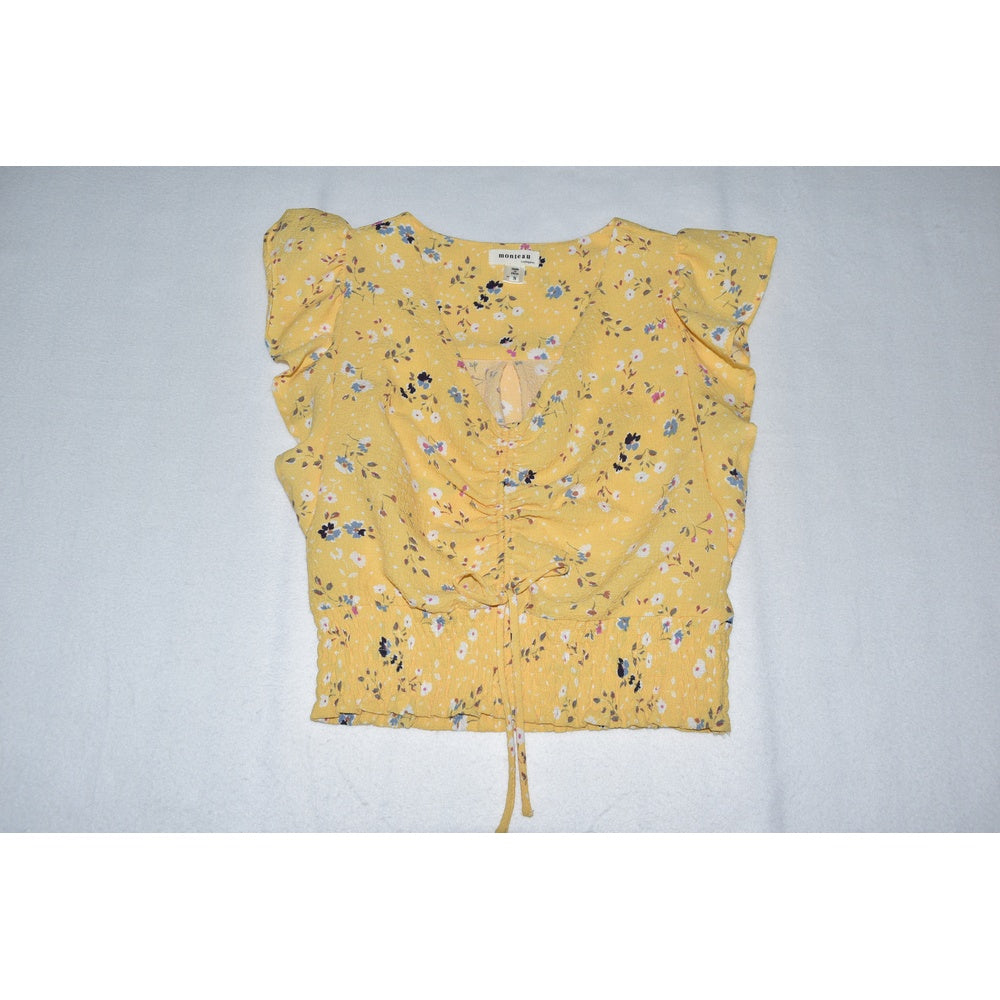 Front view on Monteau crop top yellow floral on a light gray background