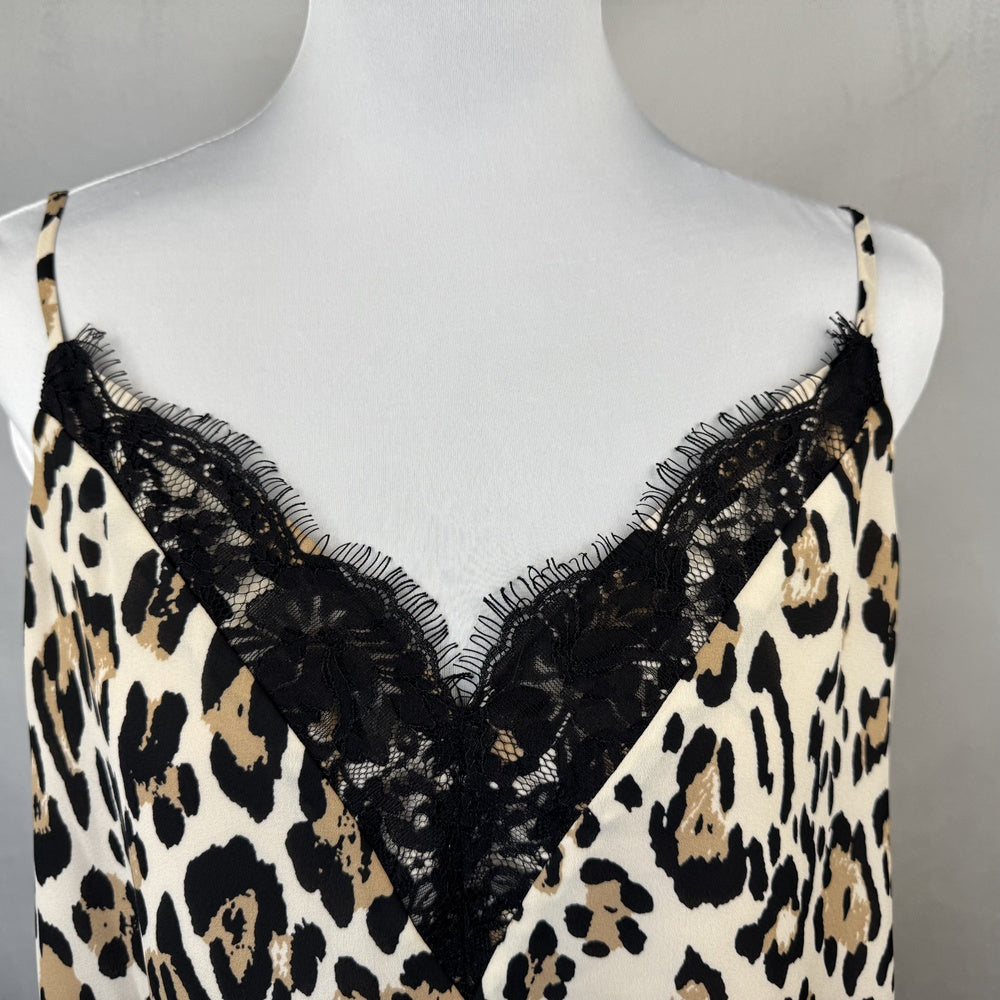 Front detail view of Socialite leopard print slip with black lace trim on a mannequin against a gray background