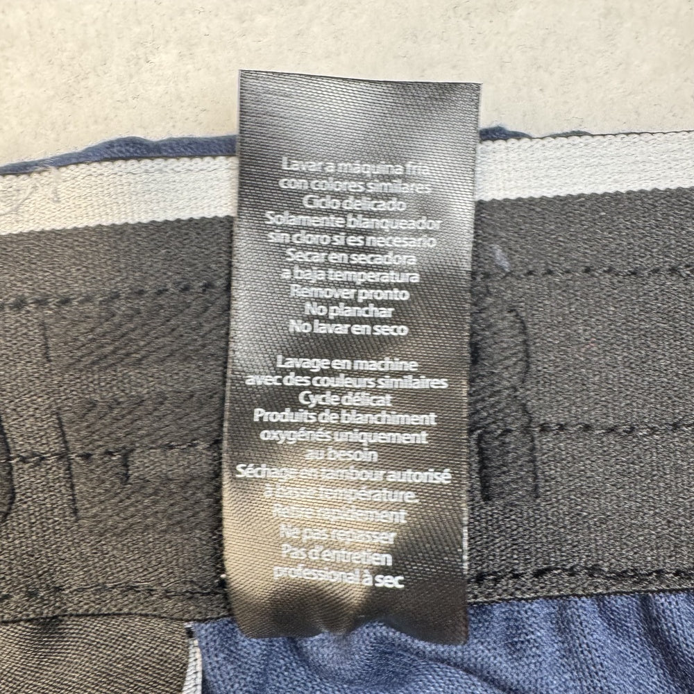 Clothing care tag view on Spyder blue jogger pants, size M