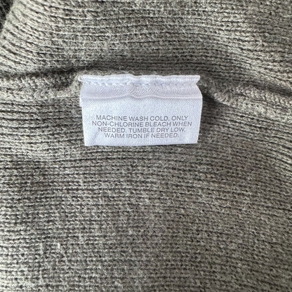 Clothing care tag on a Structure knit green sweater size L