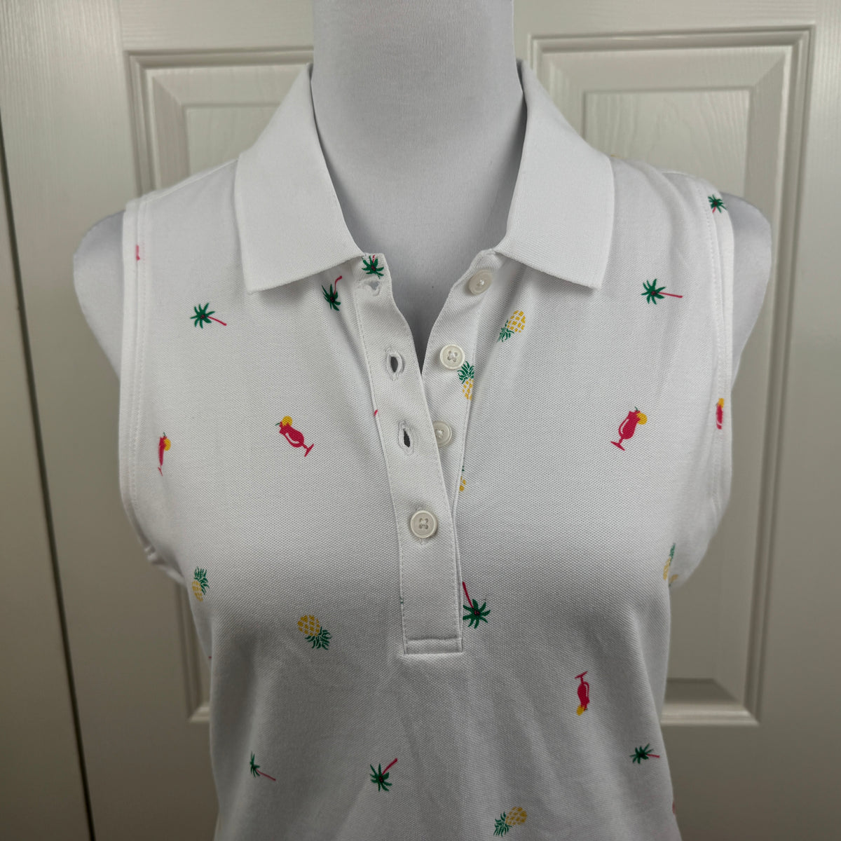 Tommy Bahama NWT Women's Everyday Active Tropical Print Sleeveless Polo White Size MNWT Tommy Bahama Women's Everyday Active Tropical Print Sleeveless Polo White Size M
