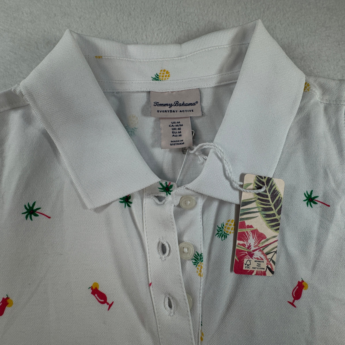 Tommy Bahama NWT Women's Everyday Active Tropical Print Sleeveless Polo White Size MNWT Tommy Bahama Women's Everyday Active Tropical Print Sleeveless Polo White Size M