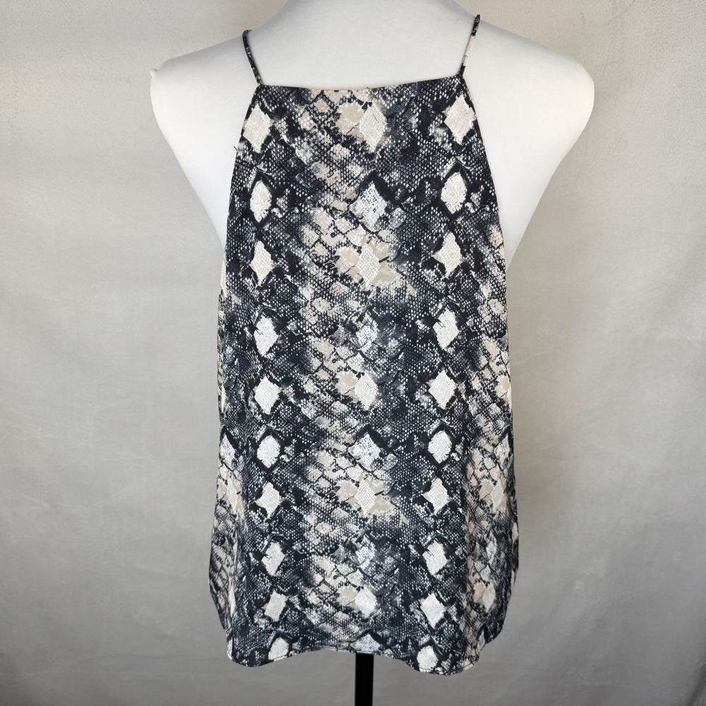 Back view on WAYF camisole black and white patterned top on a mannequin against a gray background