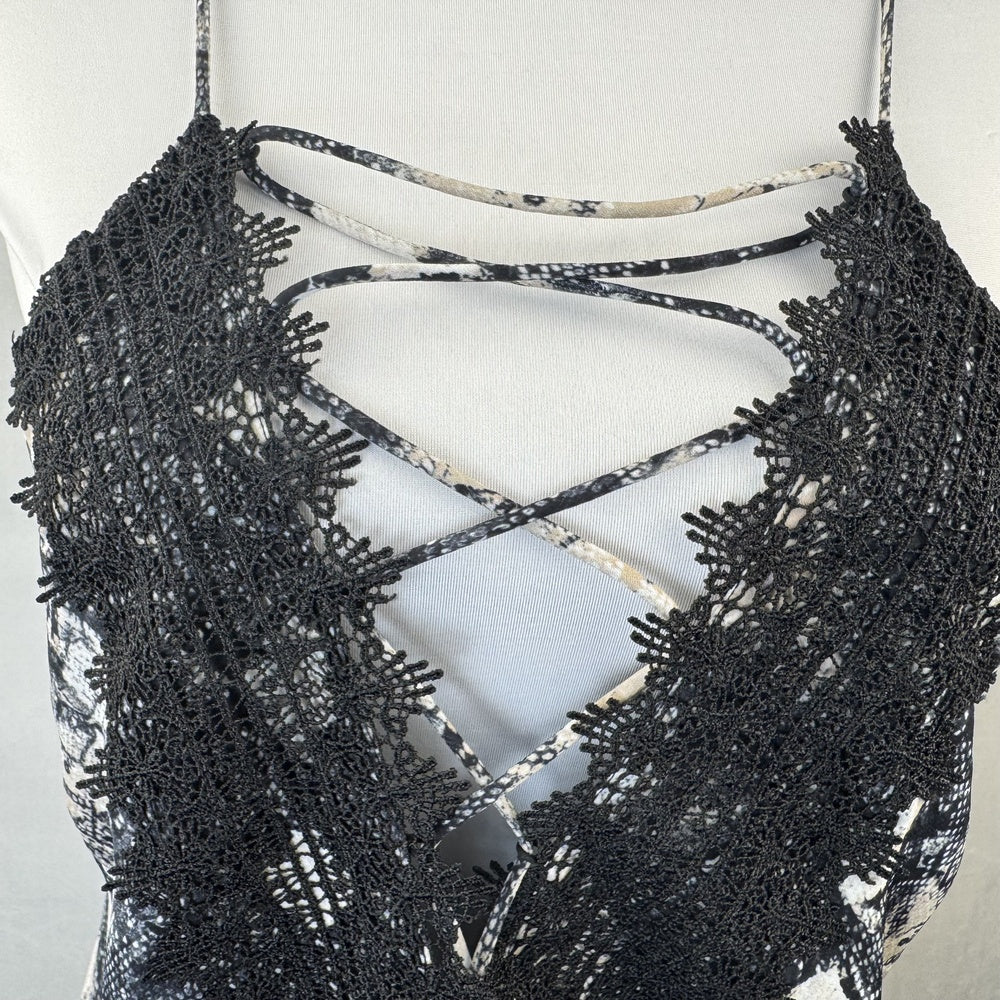 Front detail view on Wayf camisole black lace top on a mannequin against a white background