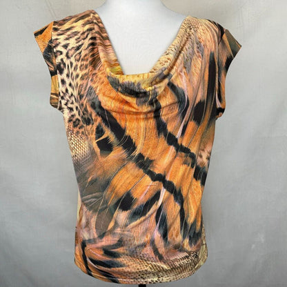 A short-sleeve cowl-neck top with a mixed animal print pattern featuring tiger stripes, leopard spots, and snake skin textures in orange, brown, black, and beige, displayed on a white mannequin torso against a gray background.