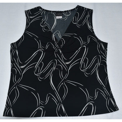 A sleeveless black V-neck top with an abstract white wavy line pattern, laid flat on a light gray background.