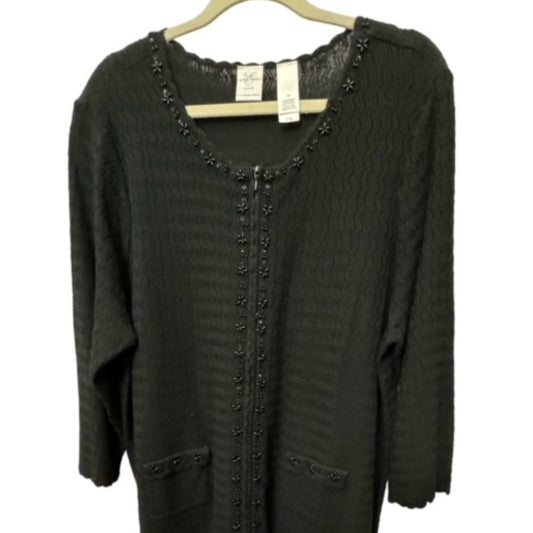 A dark charcoal gray knit cardigan sweater with scalloped edges and decorative bead trim, hanging on a wooden hanger against a white background.
