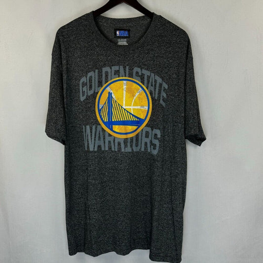 A dark heather gray Golden State Warriors t-shirt hanging on a black hanger against a light gray wall. The shirt features a distressed yellow and blue circular Warriors logo in the center with 'GOLDEN STATE WARRIORS' text arched above and below in gray.