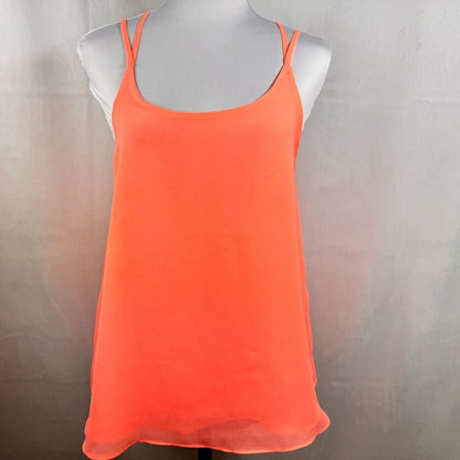 A bright neon orange sleeveless camisole tank top displayed on a white mannequin torso against a neutral gray fabric backdrop.