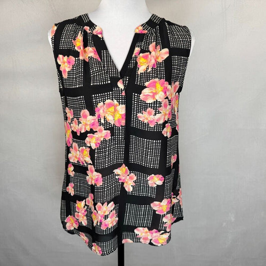 A sleeveless black blouse with a pink and yellow floral print over a white grid pattern, displayed on a white mannequin torso against a light gray background.