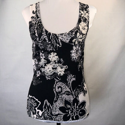 Black and white floral print sleeveless tank top displayed on a white dress form mannequin against a light gray background.