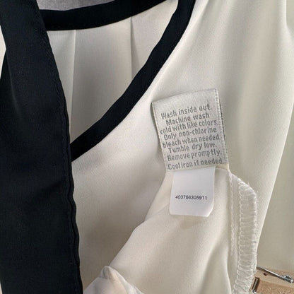 Lauren Conrad Blouse Sz L Bone/Cream with black edged neckline back knot closure