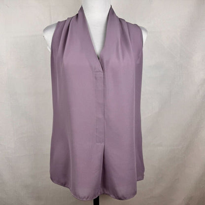 A sleeveless lavender-purple draped vest or shrug displayed on a white mannequin torso against a light gray fabric backdrop.