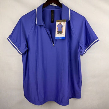 A royal blue short-sleeve polo shirt with white piping on the collar and sleeve cuffs, hanging on a dark wooden hanger against a light gray fabric backdrop. The shirt has a half-zip collar and is still attached to its retail hangtag.