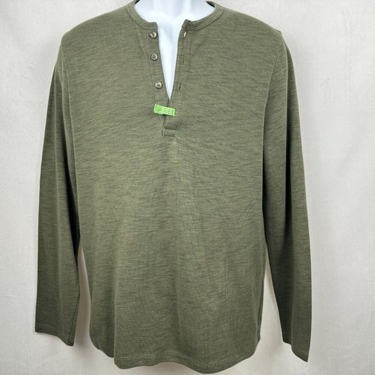 An olive green long-sleeve henley shirt displayed on a white mannequin torso against a light gray fabric background.