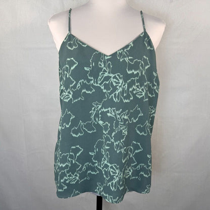A slate green camisole top with a white abstract floral pattern, displayed on a white mannequin torso against a light gray fabric backdrop.