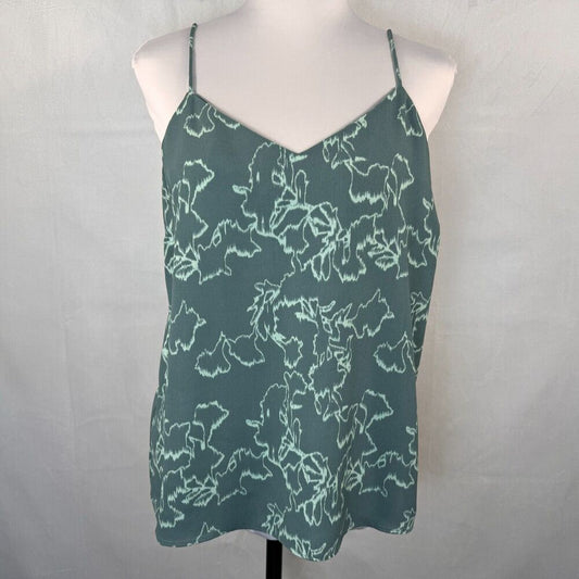 A slate green camisole top with a white abstract floral pattern, displayed on a white mannequin torso against a light gray fabric backdrop.