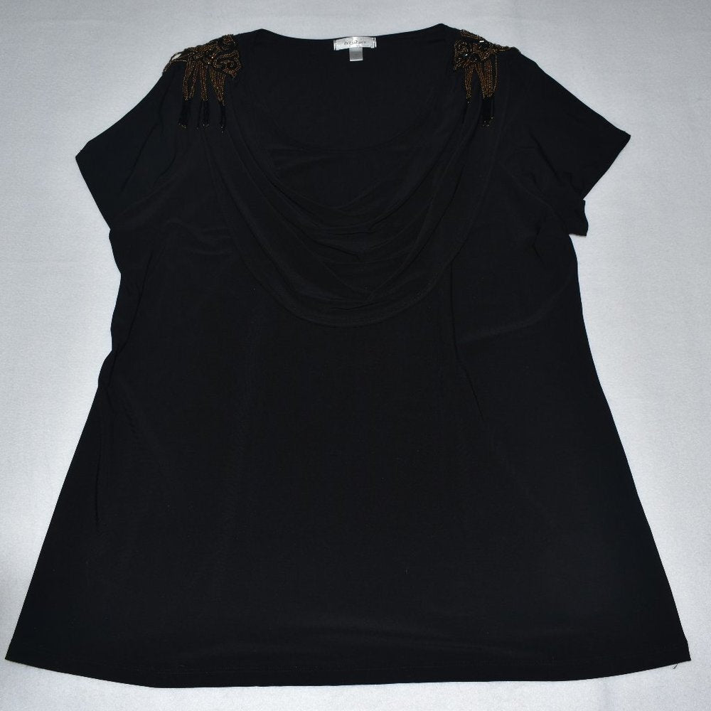 A black short-sleeve top with a draped neckline and brown beaded bow details on the shoulders, laid flat on a light gray background.