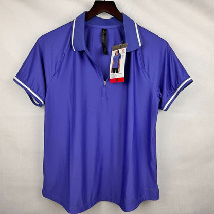 A royal blue short-sleeve polo shirt with white piping on the collar and sleeve cuffs, hanging on a dark wooden hanger against a light gray fabric backdrop. A hangtag is attached to the collar.
