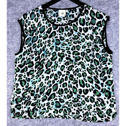 A sleeveless crop top with a green, black, and white leopard print pattern, laid flat on a gray textured background.