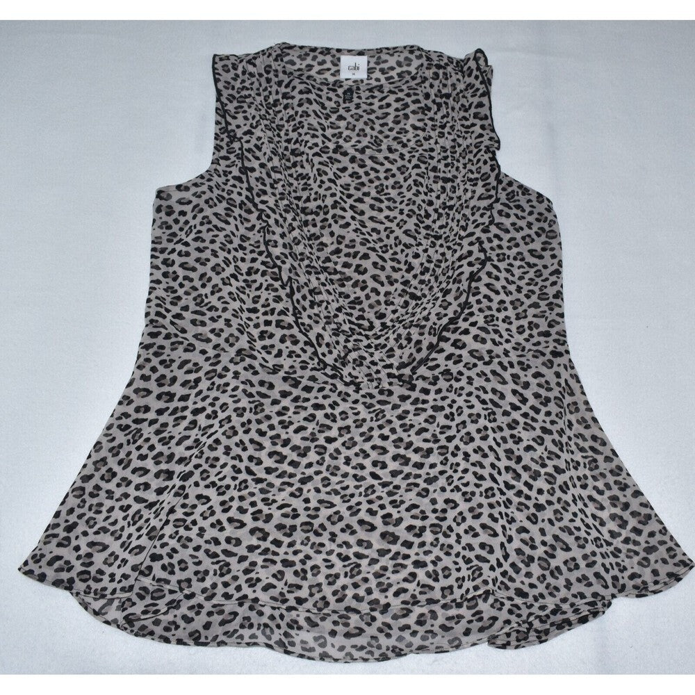 A sleeveless leopard print top in a sheer gray and black pattern, laid flat on a light gray background.