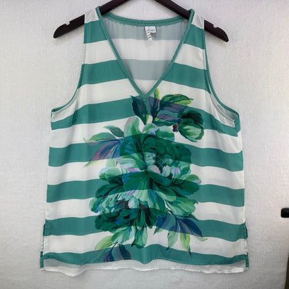 A sleeveless V-neck tank top with horizontal teal and white stripes and a large green floral print on the front, hanging on a black hanger against a white textured wall.
