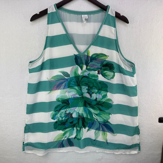 A sleeveless V-neck tank top with horizontal teal and white stripes and a large green floral print on the front, hanging on a black hanger against a white textured wall.