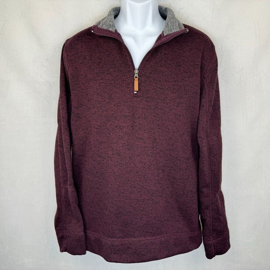 A men's quarter-zip pullover sweater in heathered burgundy, displayed on a white mannequin torso. The collar is lined in a contrasting heather gray fabric, and the zipper pull features a small tan leather tab.