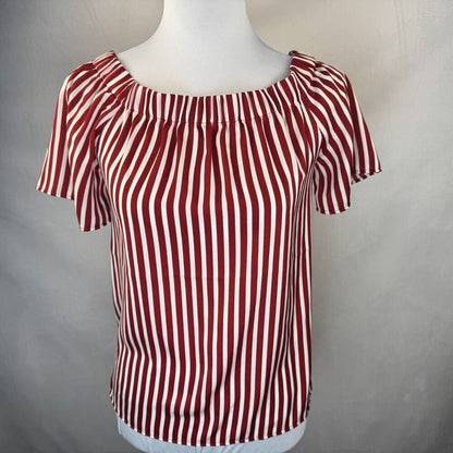A red and white vertically striped short-sleeve blouse with a pleated off-the-shoulder neckline, displayed on a white mannequin torso against a neutral gray background.