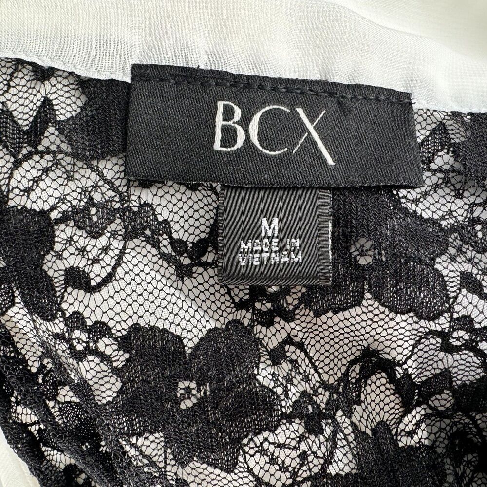 BCX Ladies Blouse Sz M White VNeck Ruffles Sleeveless Black Lace Back