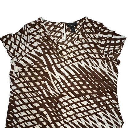 A women's short-sleeve top with an abstract brown and off-white geometric pattern, featuring a split V-neckline with bead embellishments. The brand label 'Sears' is visible inside the collar.