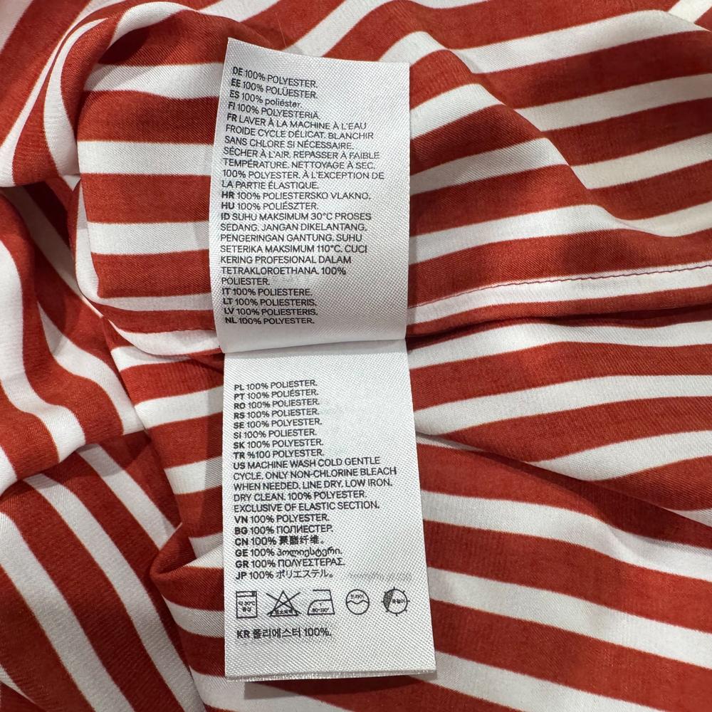 Clothing material label view on H & M women's brown striped crop top size 0 