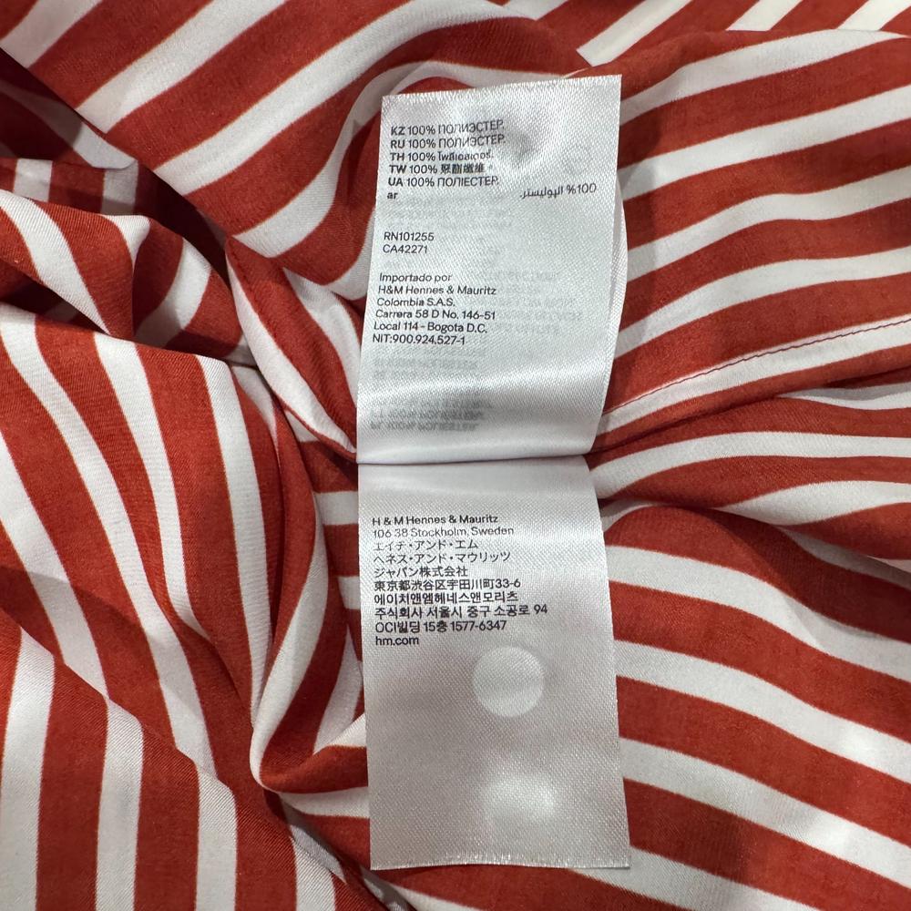 Clothing material label view on H & M women's brown striped crop top brown size 0